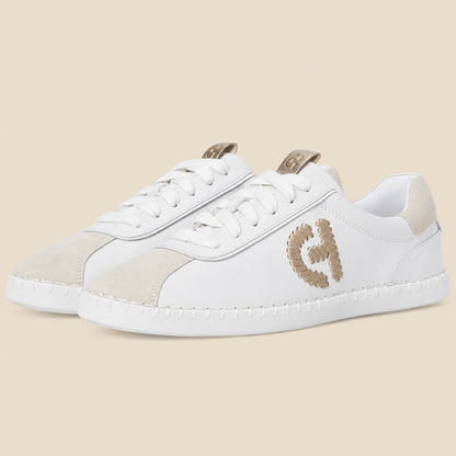Cole Haan Grandpro Acelia Sneakers — side view on cream background