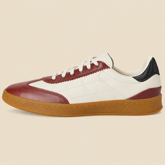 Cole Haan Grandpro Breakaway Sneakers — side view on cream background