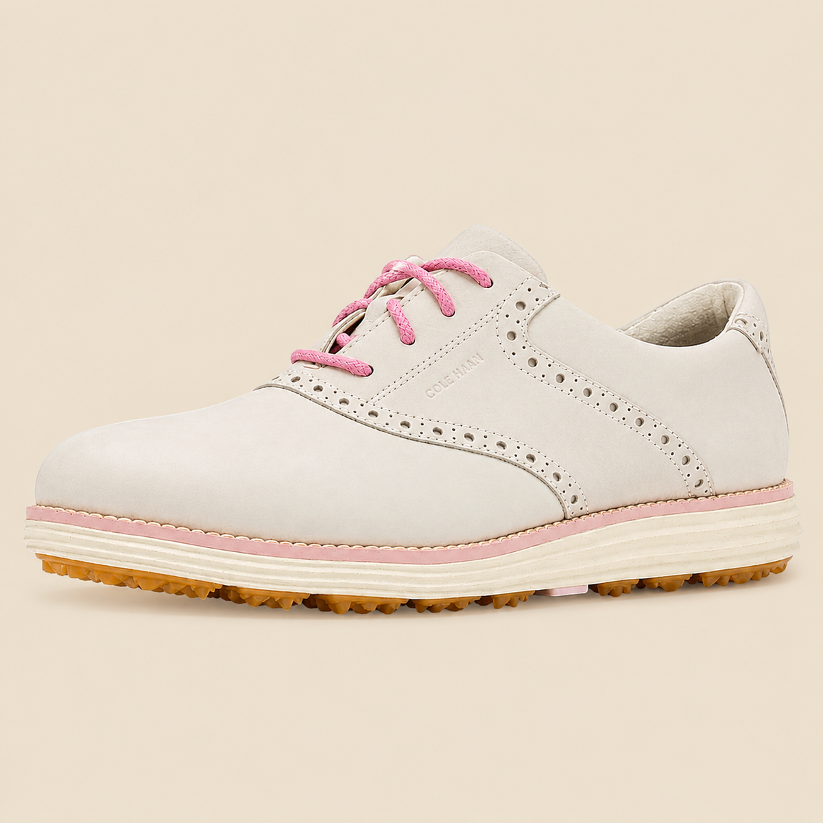 Cole Haan OriginalGrand Saddle Golf — side view on cream background