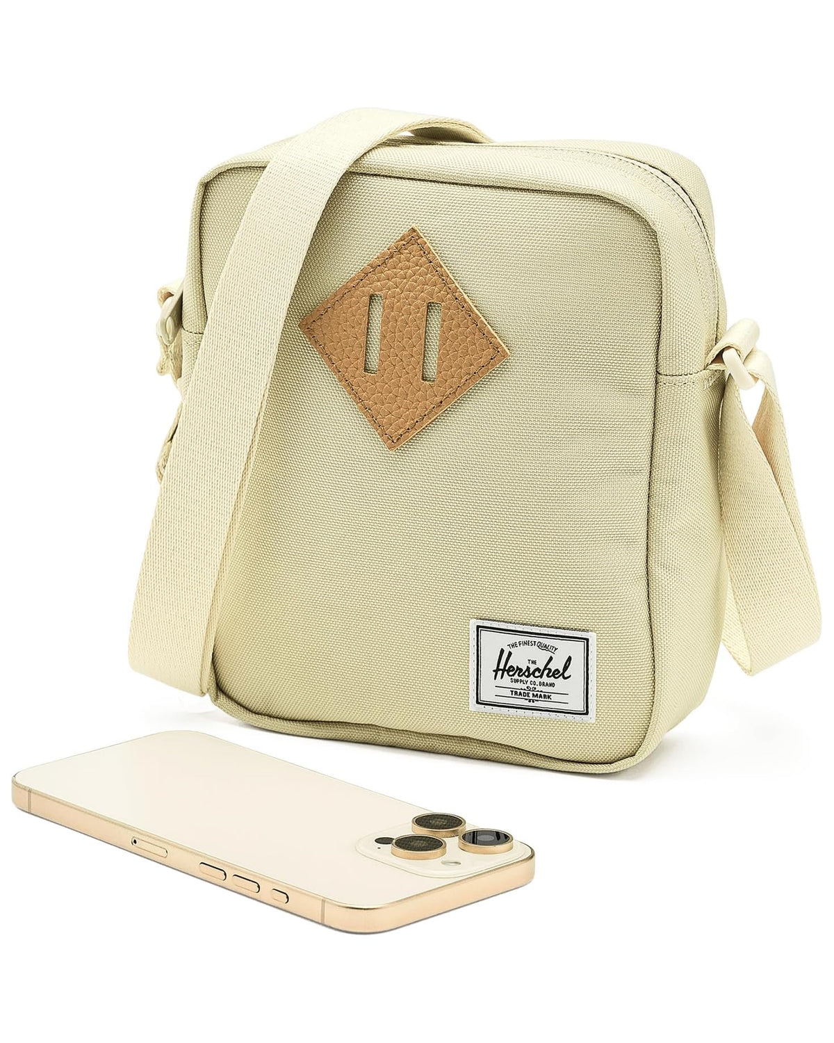 Herschel Heritage Crossbody — front view with phone for scale